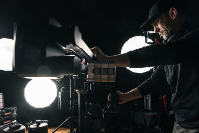 Side view of man working in workshop