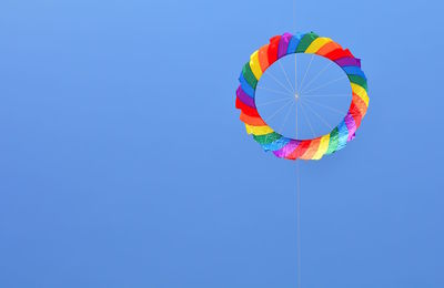 Low angle view of hot air balloon against blue sky