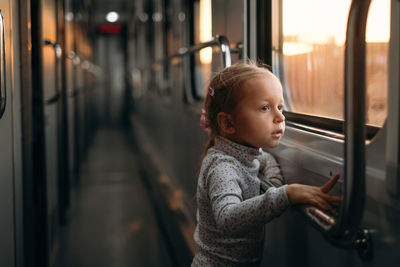 Portrait of boy sitting in bus