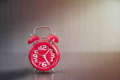 Close-up of clock on table