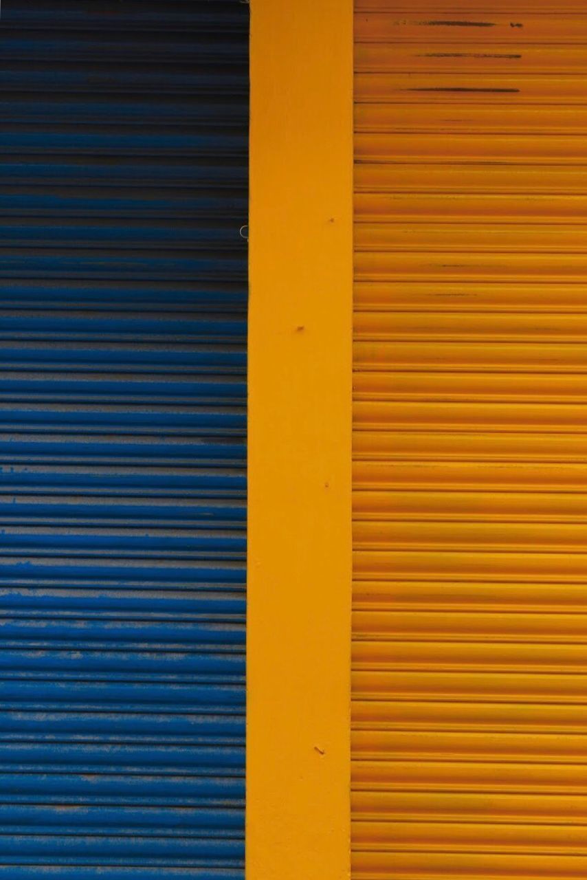 FULL FRAME SHOT OF YELLOW WALL