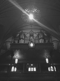 Low angle view of illuminated lights hanging in ceiling