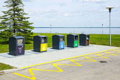 Five new containers for different waste sorting in the city square by the sea