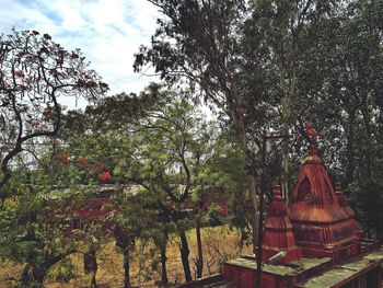 Low angle view of statue against trees