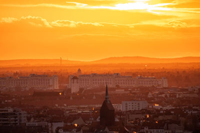 High angle view of city at sunset