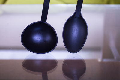 Close-up of ladles on table