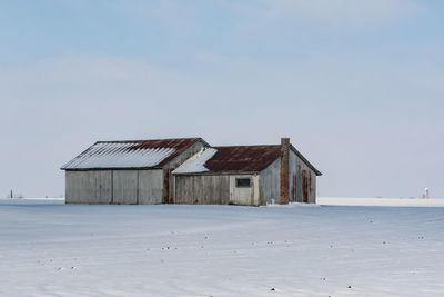 House by sea against sky