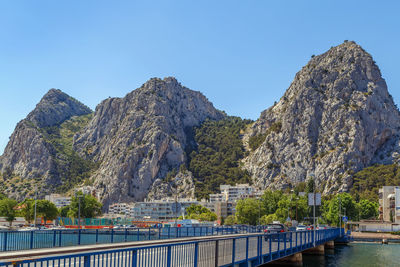 Scenic view of mountains against clear blue sky