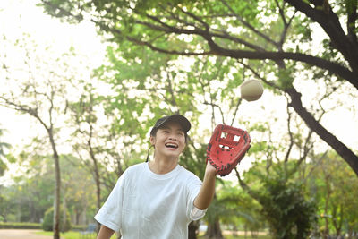 Low angle view of woman holding red lantern