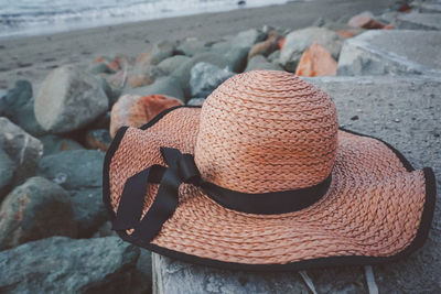 Close-up of hat on rock