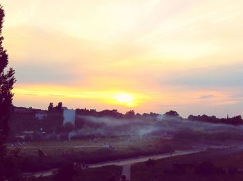 Scenic view of landscape at sunset