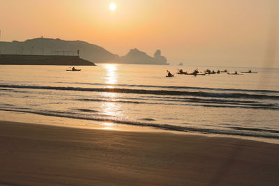 Scenic view of sea against sky during sunset