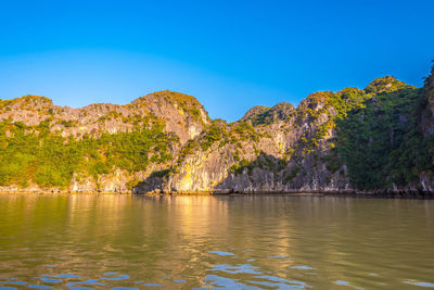 Scenic view of lake against blue sky
