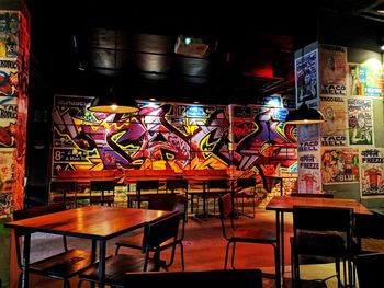 Empty chairs and tables in restaurant