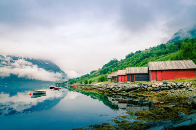 Scenic view of buildings and mountains against sky