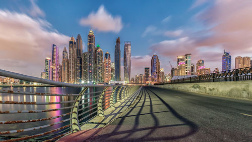 View of skyscrapers against cloudy sky