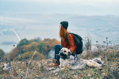 Dog looking away on field