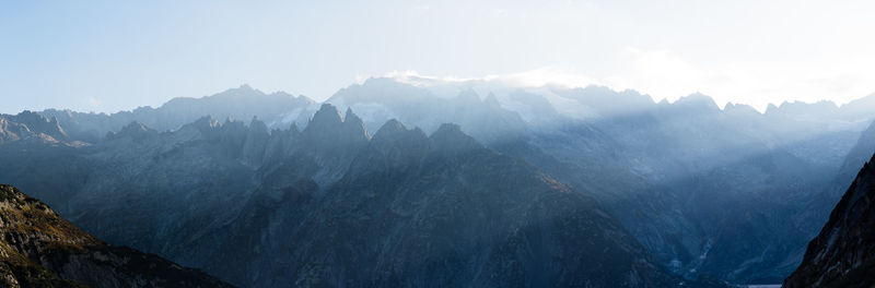 Panoramic view of mountains against sky