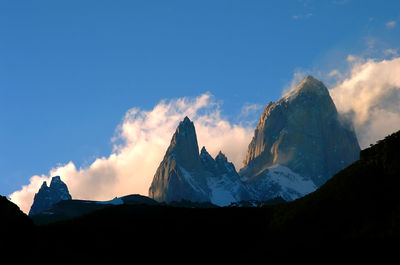 Panoramic view of silhouette mountains against sky during sunset