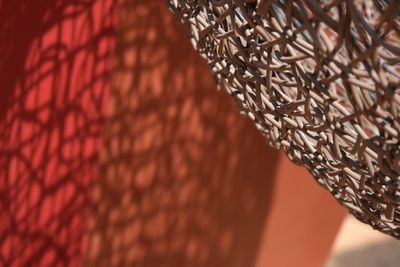 Close-up of chain hanging on wall