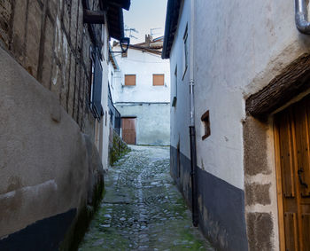 Narrow alley along buildings