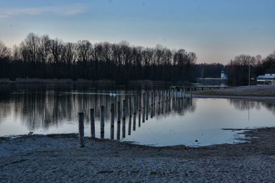 Scenic view of lake against sky during winter