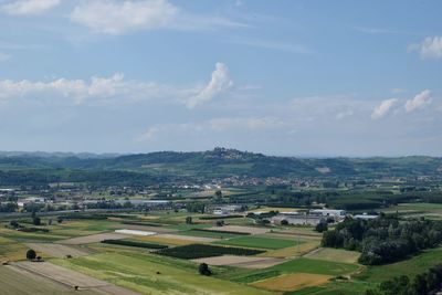 Scenic view of agricultural field against sky