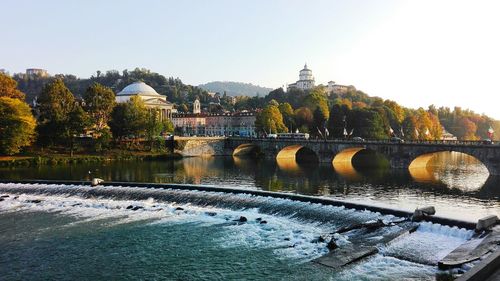 Bridge over river against clear sky