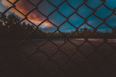 Full frame shot of chainlink fence during dusk