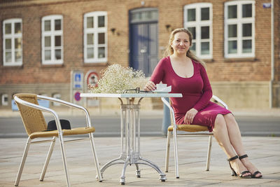 Young woman sitting on chair