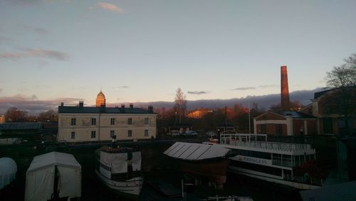 Buildings against sky at sunset