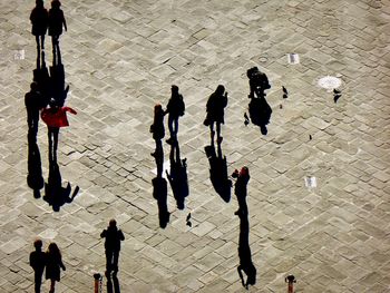 High angle view of people walking on footpath