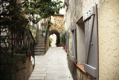 Footpath amidst buildings