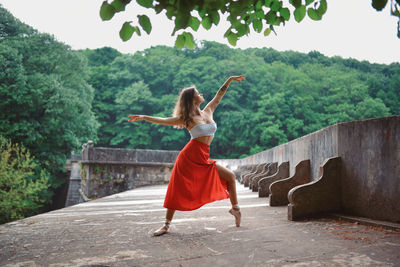 Young woman dancing outdoors