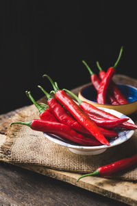 Close-up of red chili peppers on table