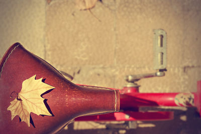 Close-up of bicycle on metal wall