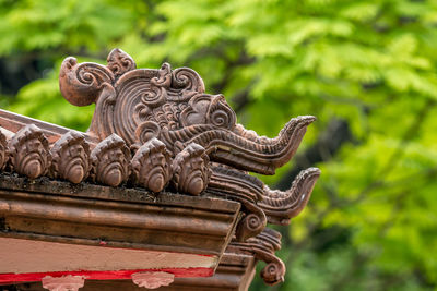 Low angle view of statue against building