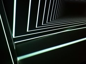 Low angle view of illuminated lighting equipment