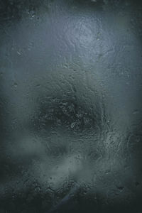 Full frame shot of wet glass window