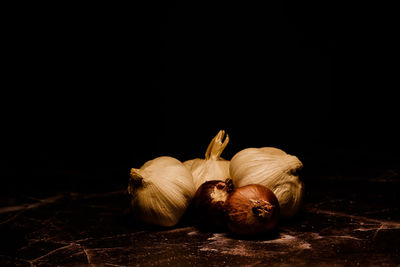 Close-up of garlic against black background