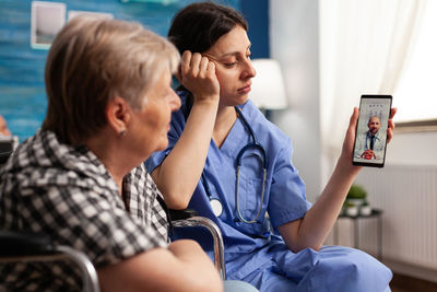 Doctor consulting patient on video call