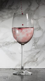 Close-up of wineglass on table