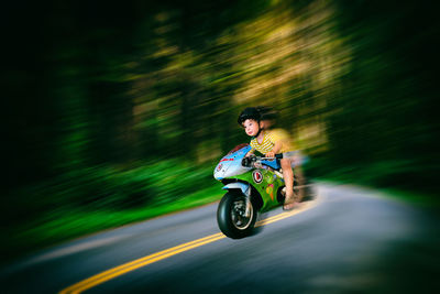 Man riding bicycle on road