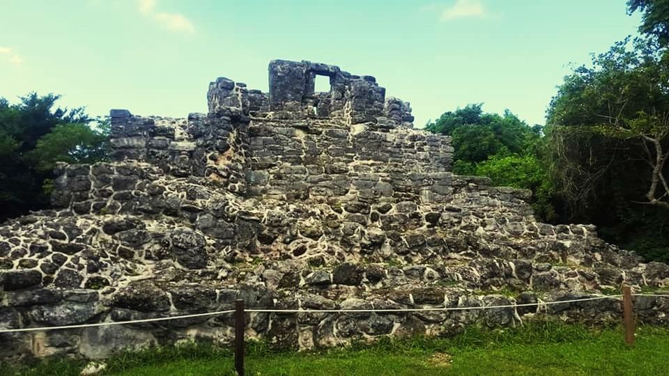 old ruin, history, ancient, ancient civilization, day, archaeology, travel destinations, architecture, built structure, sky, outdoors, damaged, tourism, tree, no people, nature, bad condition, grass, pyramid, growth, building exterior