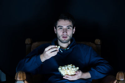 Portrait of man eating food