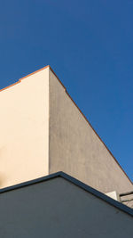 Low angle view of building against blue sky
