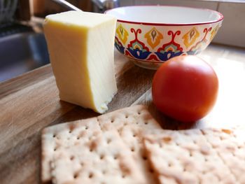 Close-up of egg and bread on cutting board