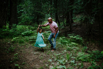 Full length of a man with woman in forest