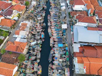 Beautiful aerial view of boats lined up in a fishing village, west java - indonesia.