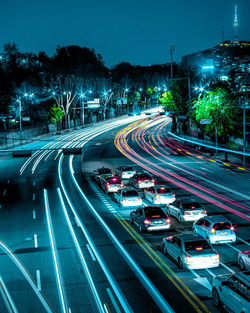 High angle view of light trails on road at night